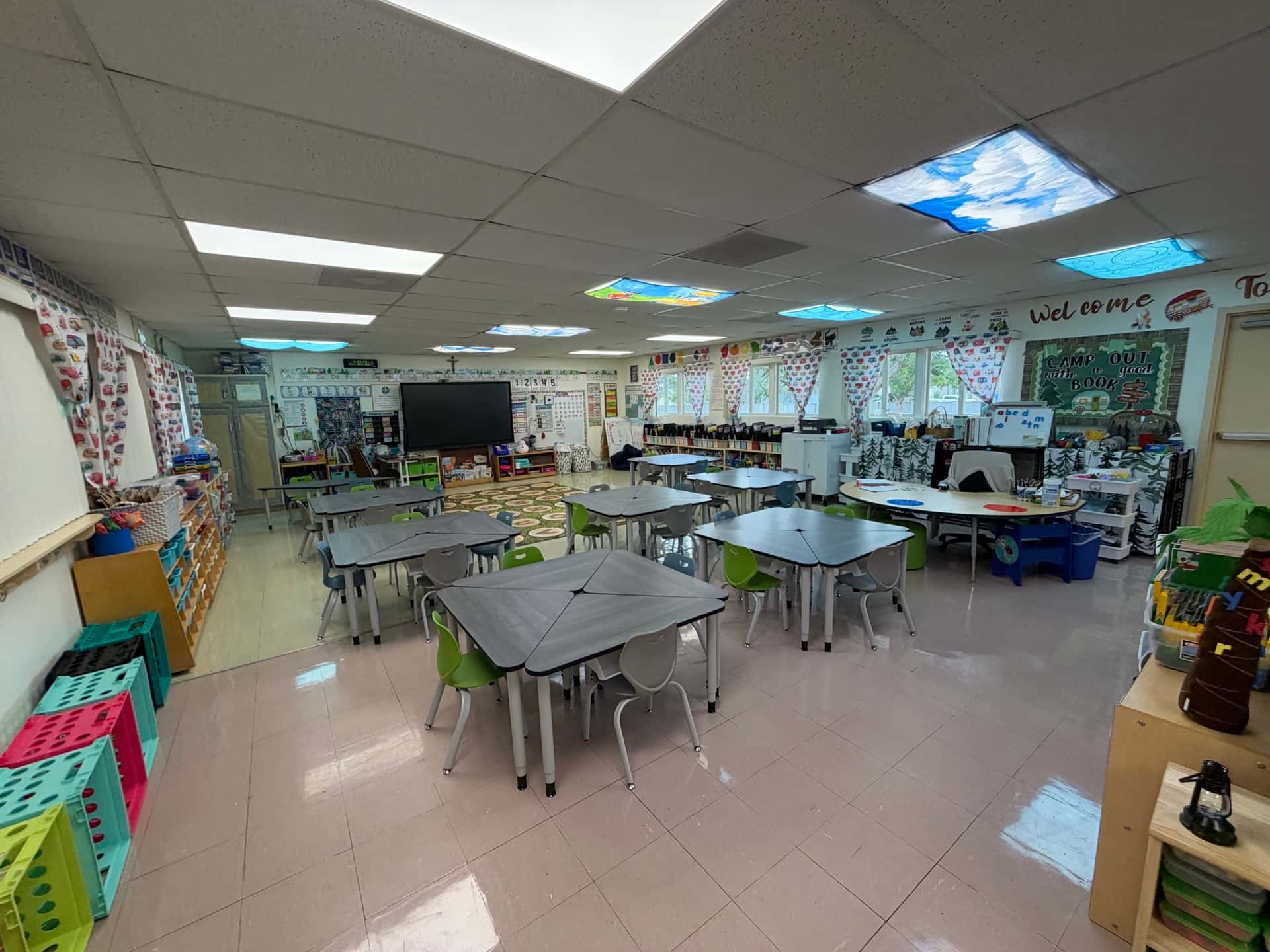 K-8 classroom at Holy Name of Jesus Catholic School with trapezoid activity tables and stack chairs