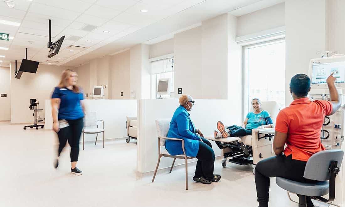 Clean, professional healthcare facility waiting area with durable clinical-grade seating and workstations