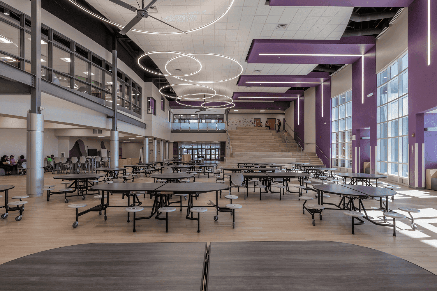 School cafeteria with folding cafeteria tables and stack chairs in a Florida K-12 institution