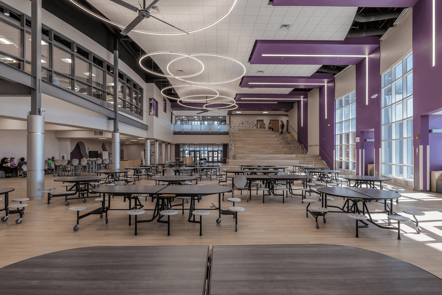 School cafeteria with folding cafeteria tables and stack chairs in a Florida K-12 institution