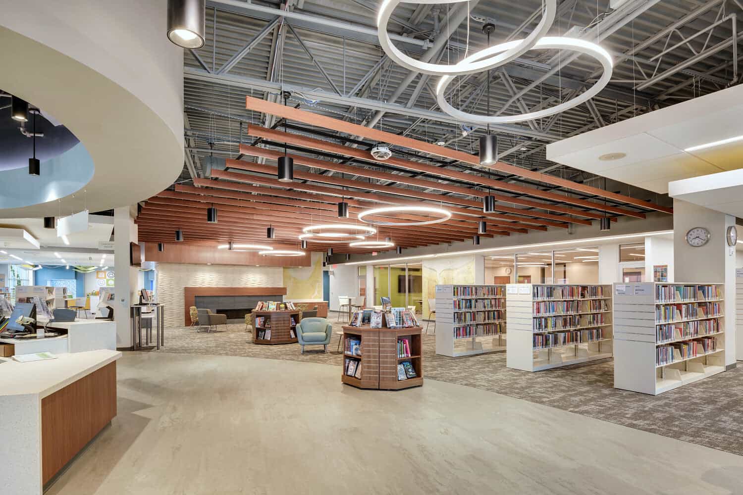 Modern school library with collaborative seating, shelving systems, and flexible study areas in a Florida learning commons