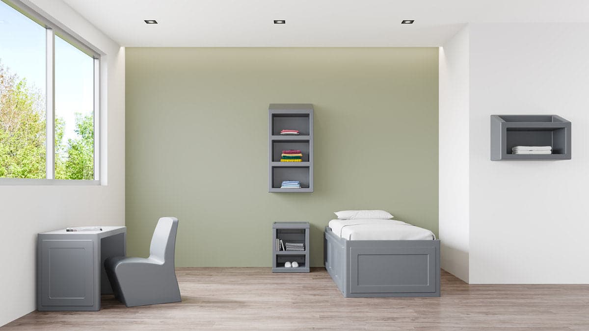 Safe and welcoming behavioral health common area with ligature-resistant furniture in a Florida mental health facility