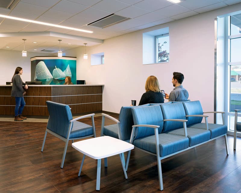 Professional reception desk and lobby lounge seating in a Florida commercial office