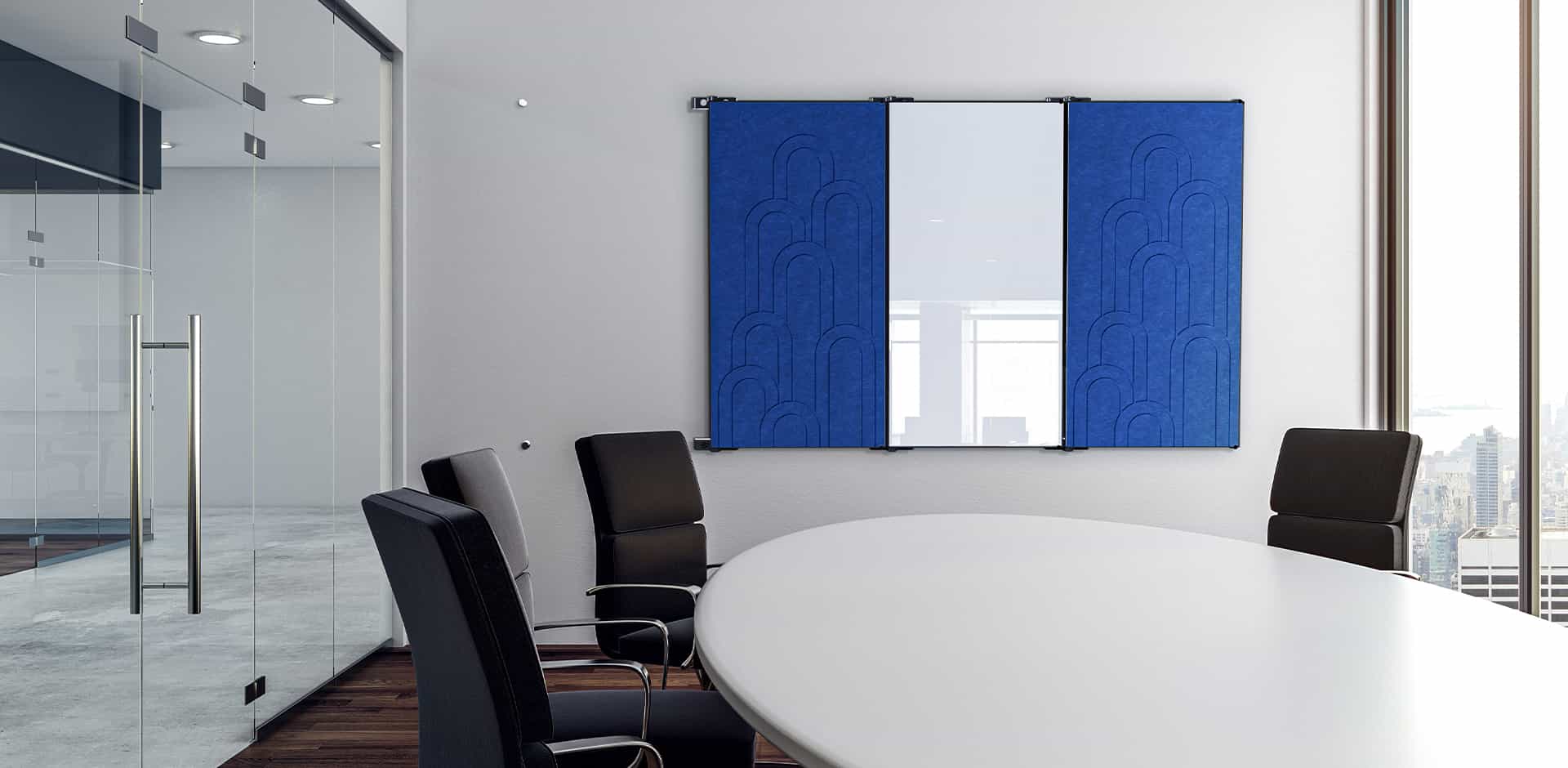 Conference room with blue acoustic felt panels flanking a wall-mounted glassboard