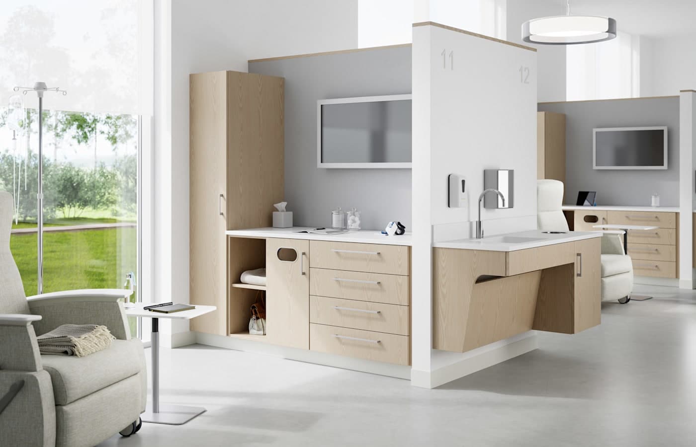 JSI Forge modular casework with solid-surface sink and storage in a modern patient care bay